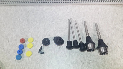 Set of colorful plastic caps, black rubber fittings, and metallic rods in richard wolf 8585.024 mini cystoscope tray