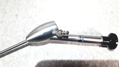 Silver metallic richard wolf mini cystoscope with tapered head and black grip in mini cystoscope tray 8585.024