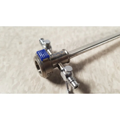 Silver surgical instrument with blue rubberized grip and metallic ports branded rüdiger for richard wolf endoscope sheath 10fr