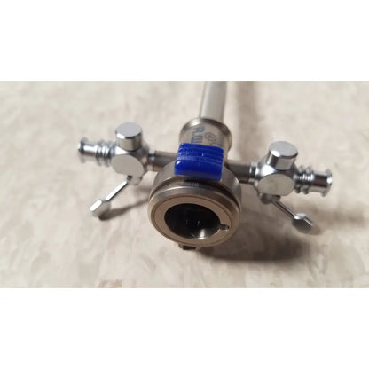 Silver-colored richard wolf endoscope sheath 10fr instrument with cylindrical body, side knobs, and blue rubber band