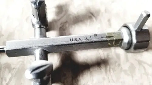 Silver metal pipe threading tool with engraved usa on richard wolf 8852.03 sheath for reuse medical applications