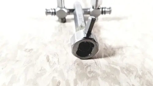Silver metallic tool with hexagonal sockets and threaded ends for richard wolf 8852.03 sheath reuse medical applications