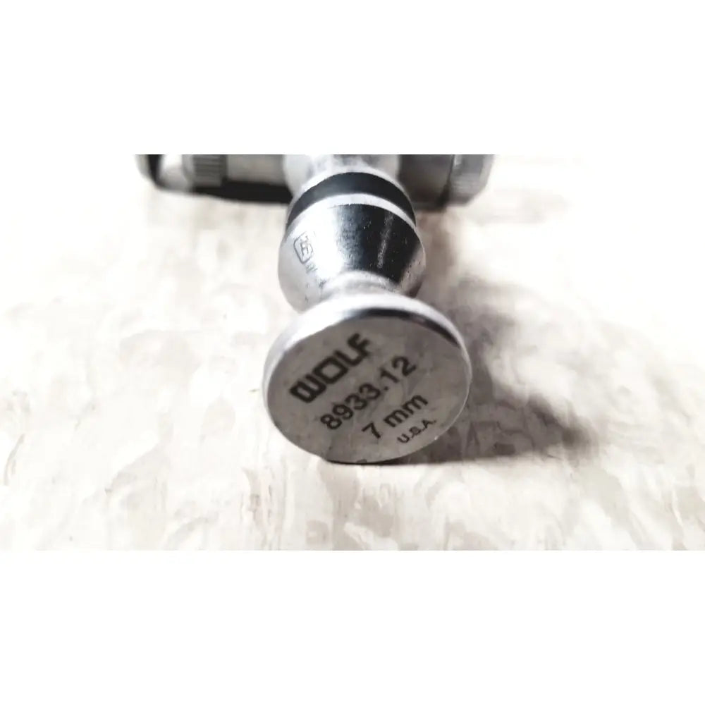 Silver metal caliper with engraved richard wolf 8933.12 marking measuring 7mm endoscope sheath diameter made in usa
