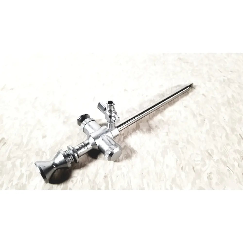 Silver richard wolf 7mm endoscope sheath with long slender shaft and adjustable knobs for precise surgical use