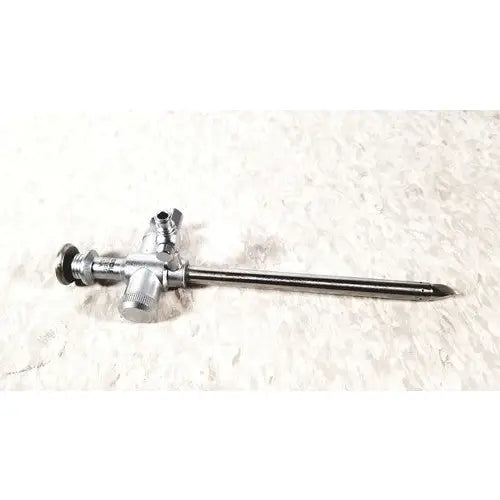 Silver richard wolf scope sheath with trocar endoscope featuring a long slender shaft and three control knobs at handle
