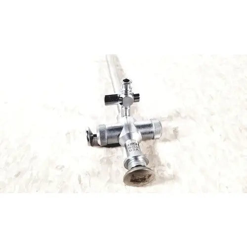 Silver-colored metal richard wolf trocar endoscope with scope sheath featuring cross-shaped handle and multiple knobs