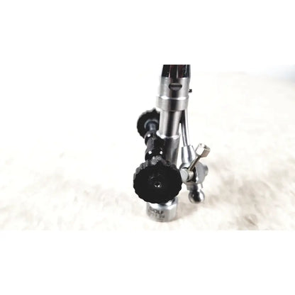Silver and black gas torch with textured grip knobs and engraved richard wolf branding for urology deflecting bridge use