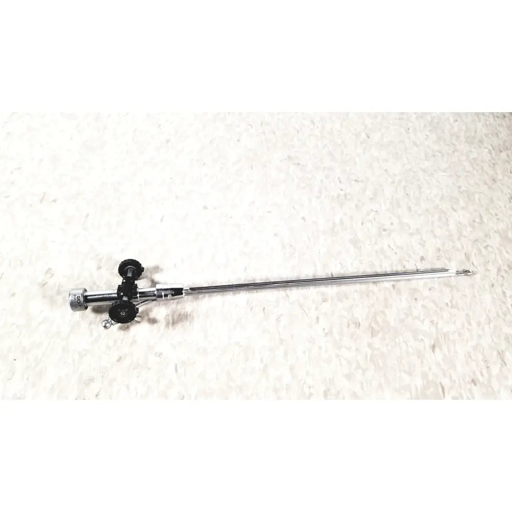 Silver richard wolf 8962.29 urology deflecting bridge with black control knobs and slender metallic endoscope shaft
