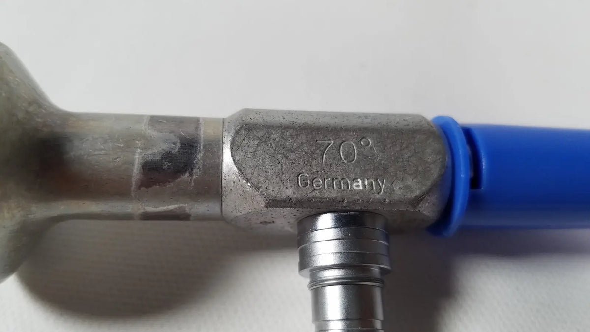 Silver metallic Richards Wolf 4.0 mm 70° arthroscope pipe fitting engraved 70° Germany connected to blue hose for reuse medical use