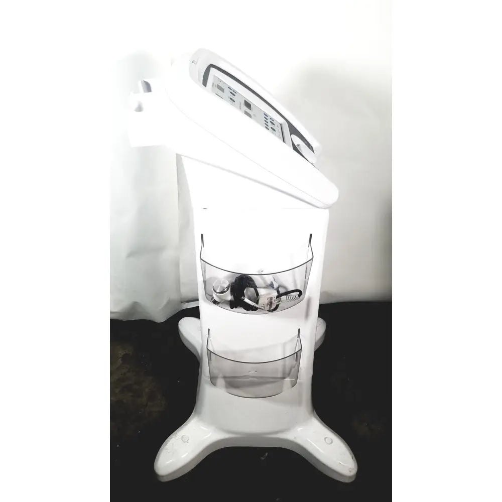 White plastic richmar winner evo st4 electrical stim device with two clear wire baskets for storage on cart