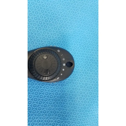 Black plastic riester ri-charger l charging base with circular dial and white indicator dots for otoscope use