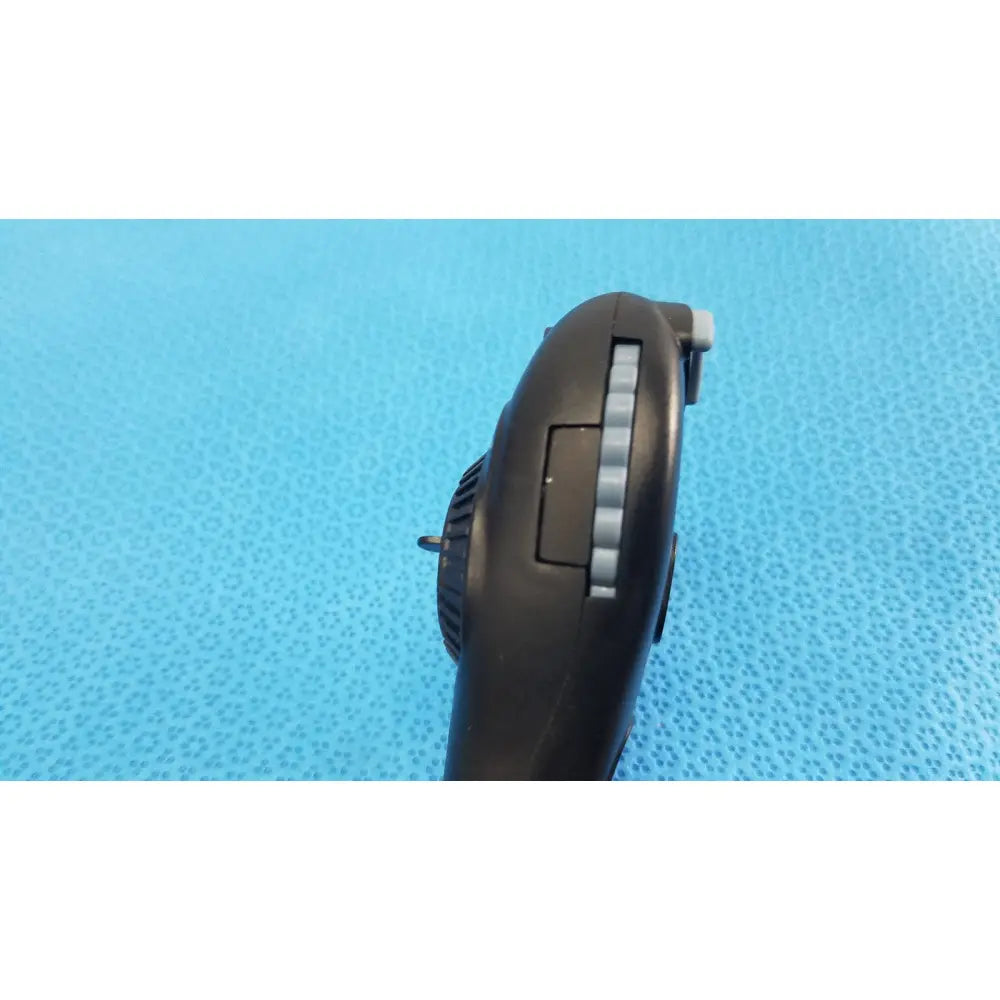 Black plastic riester ri-charger l charging base with textured grip and silver button accents for reuse medical devices