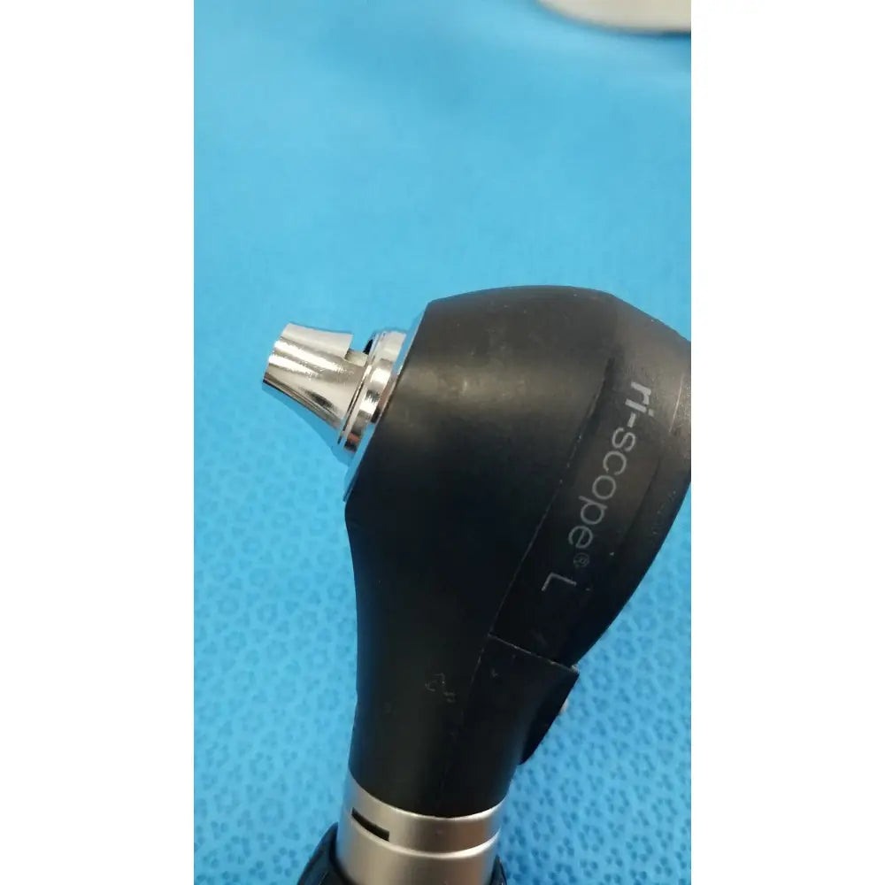 Black rubberized handle with silver metallic tip and ri-scope l branding on otoscope for riester ri-charger l charging base
