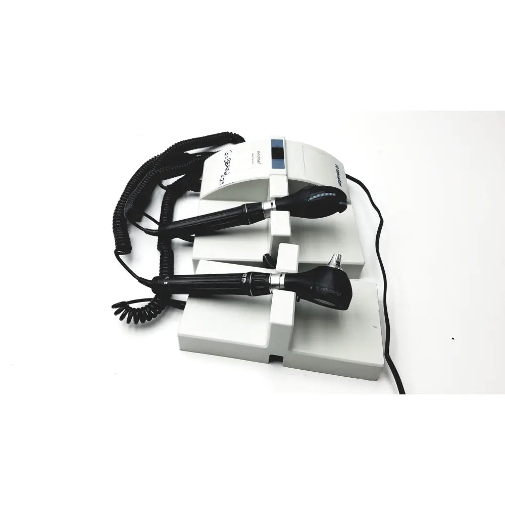 Riester Ri-former 3TCH diagnostic station L2 LED otoscope with black handles and silver accents on white charging stand