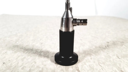 Black and silver rigid cystoscope 94509 with a cylindrical body and metallic joints designed for reuse medical procedures