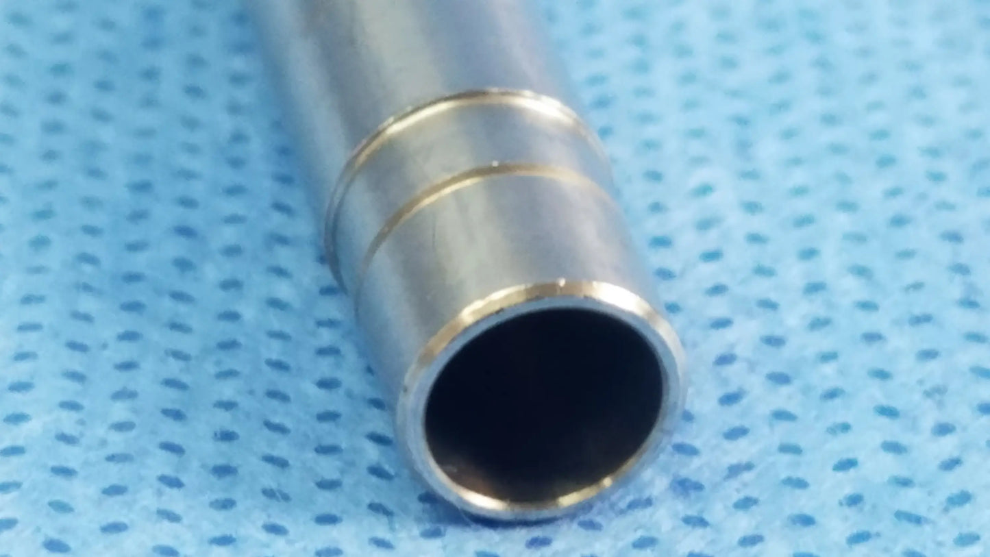 Silver-colored metal rigid endoscope light source optical fiber interface adapter connector with ridged bands near open end