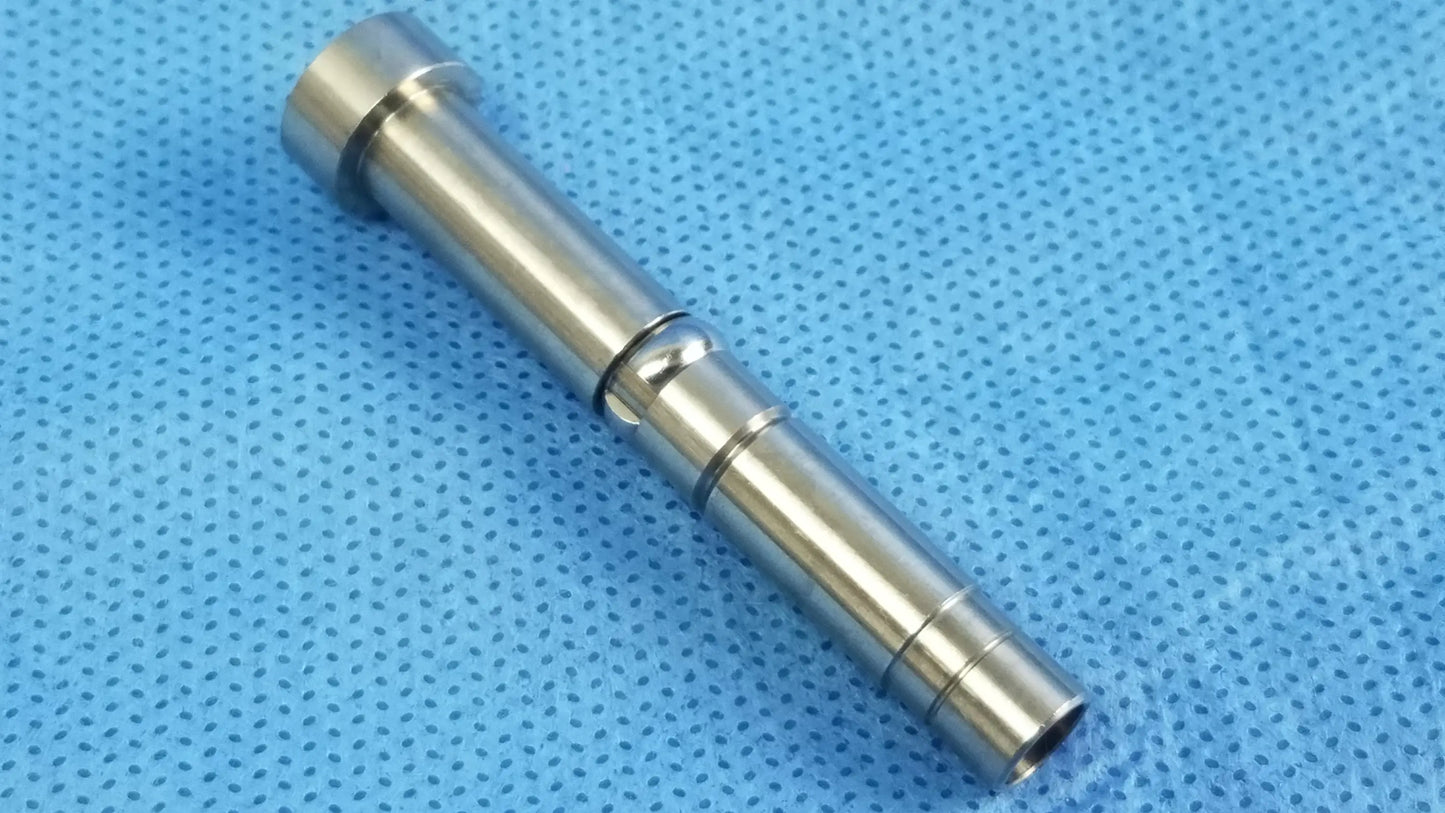 Shiny metallic cylindrical rigid endoscope light source fiber interface adapter with machined grooves and threaded ends