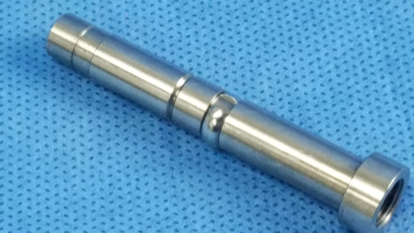 Shiny metallic rigid endoscope light source optical fiber interface adapter with machined grooves and threaded ends