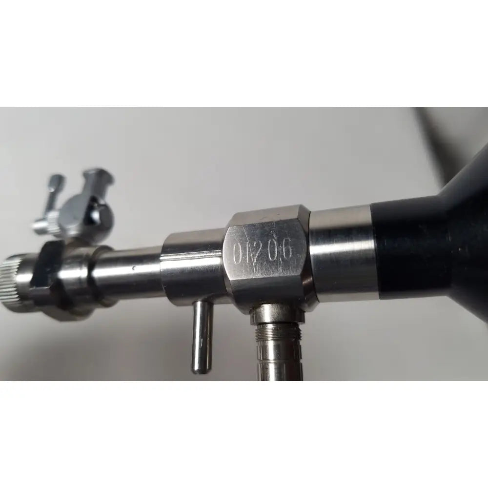Silver metallic rigid hysteroscopes endonest gas regulator with black rubber grip and engraved serial number 01206