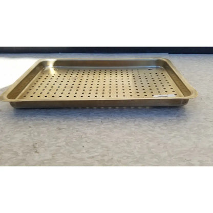 Gold-colored rectangular metal ritter autoclave sterilizer tray with evenly spaced perforations for sterilization use