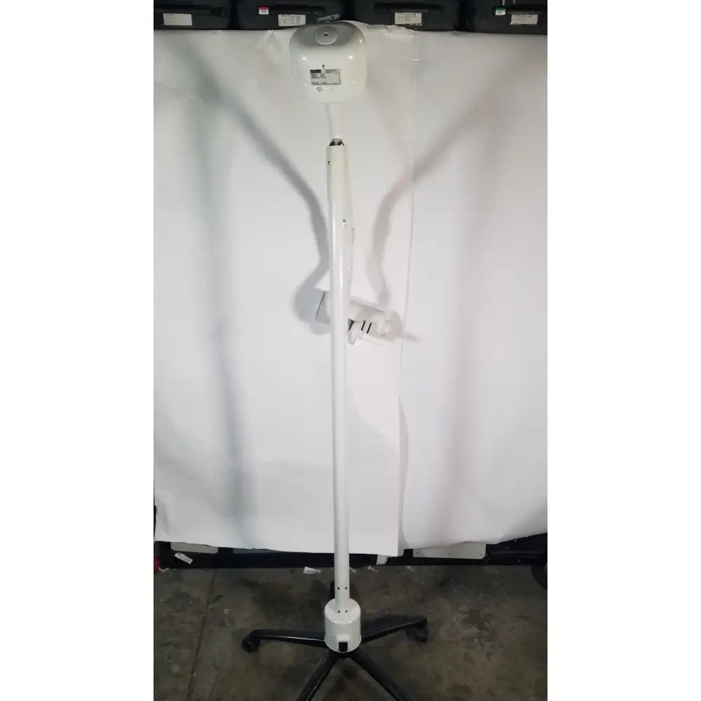 White adjustable ritter midmark portable surgery procedure light with circular head and black caster base