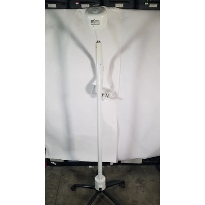 White adjustable ritter midmark portable surgery procedure light with circular head and black caster base