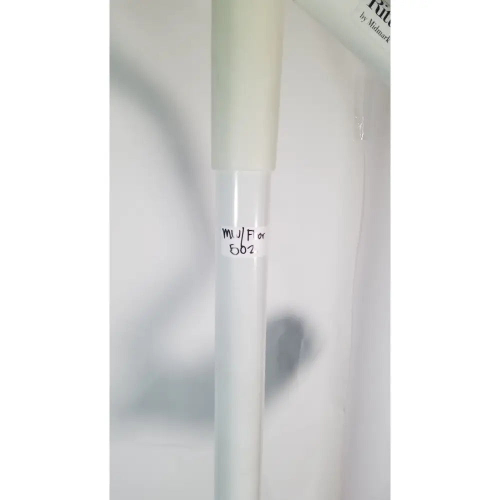 A translucent white cylindrical tube with a frosted cap and handwritten labeling for ritter midmark portable surgery procedure light
