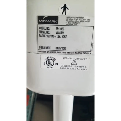 White plastic ritter midmark 354-022 portable surgery procedure light with black labeling and certification marks visible