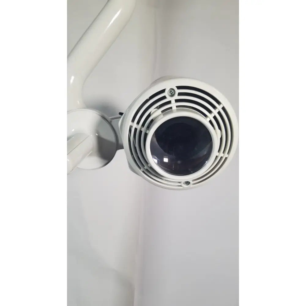 White cylindrical ritter midmark 354-022 portable surgery procedure light with black lens and circular ventilation slits