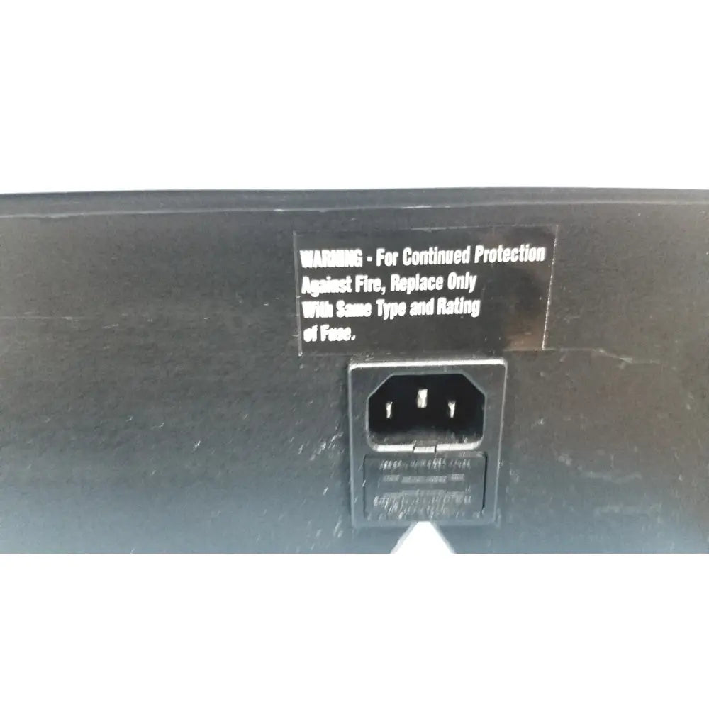 Black power supply with rectangular ac input port and fuse warning label on the back of robbins scientific hybridization incubator model 400 temperature controller