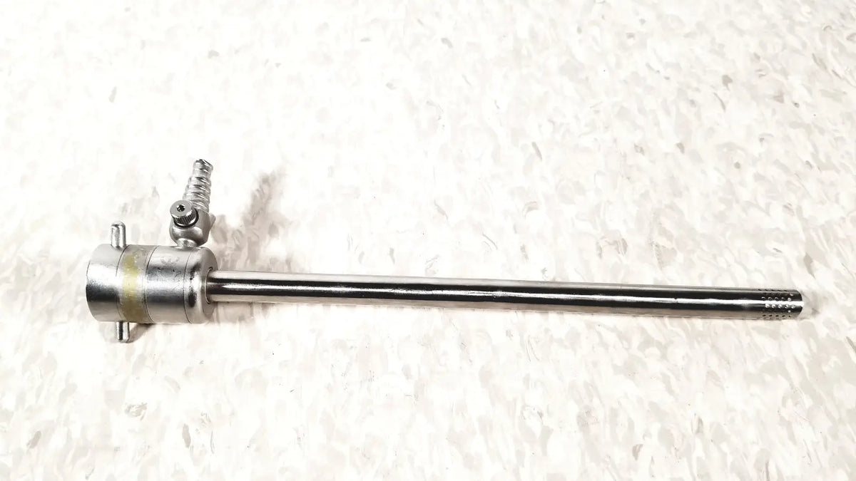 Silver rotating single stopcock cannula with threaded handle and textured tip for precise medical control