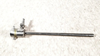 Silver rotating single stopcock cannula with threaded handle and textured tip for precise medical control