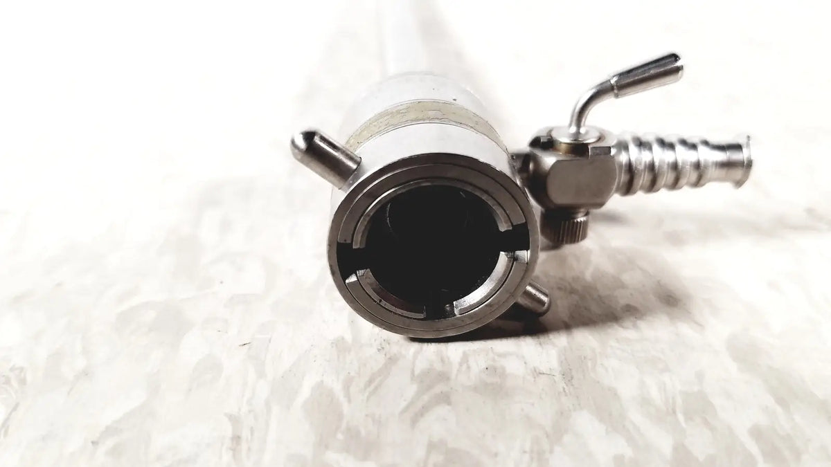 Silver metallic rotating single stopcock cannula with threaded connector and side valve mechanism for medical use