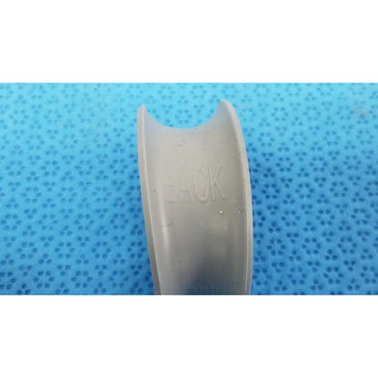 Gray plastic dental retainer showing back side with embossed back text in rubber ring front/back for reuse medical purposes
