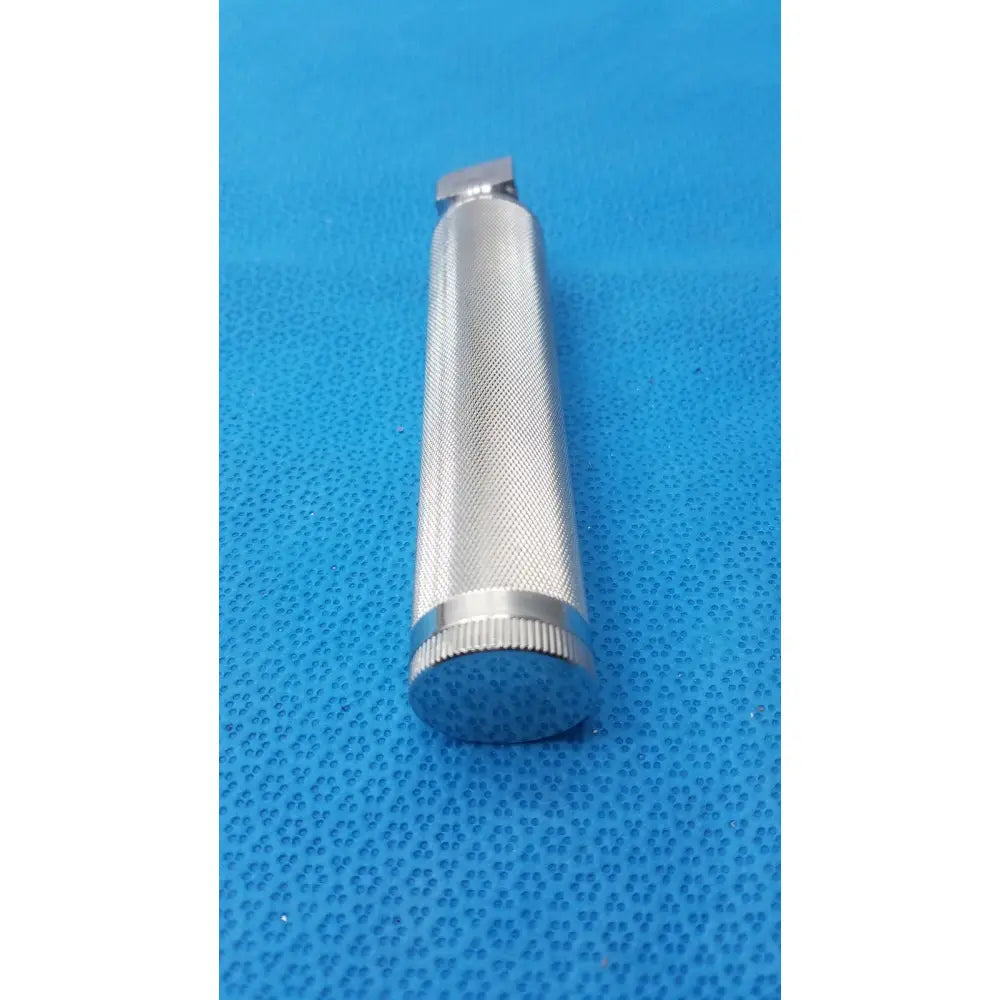 Silver metallic Rusch standard laryngoscope handle short stubby with textured grip and knurled end cap