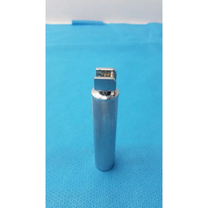 Silver metallic rusch standard laryngoscope with textured cylindrical standard laryngoscope handle short stubby design