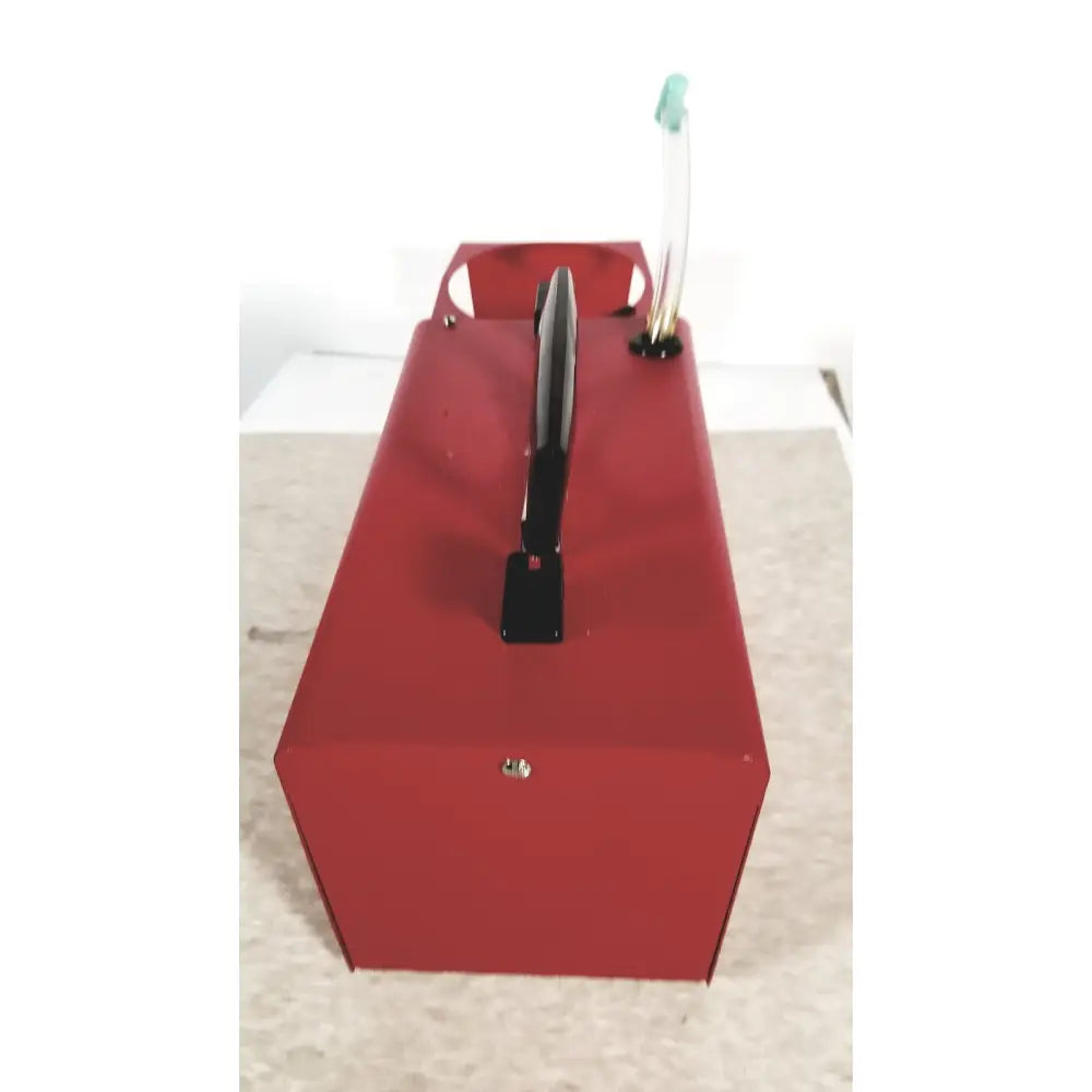 Red metal toolbox with black handle and green tipped hose in scort 40014b portable regulator suction unit
