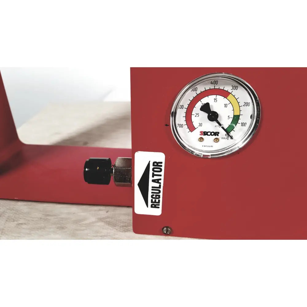 Red metal pressure regulator with circular gauge featuring color zones for scort 40014b portable regulator suction unit