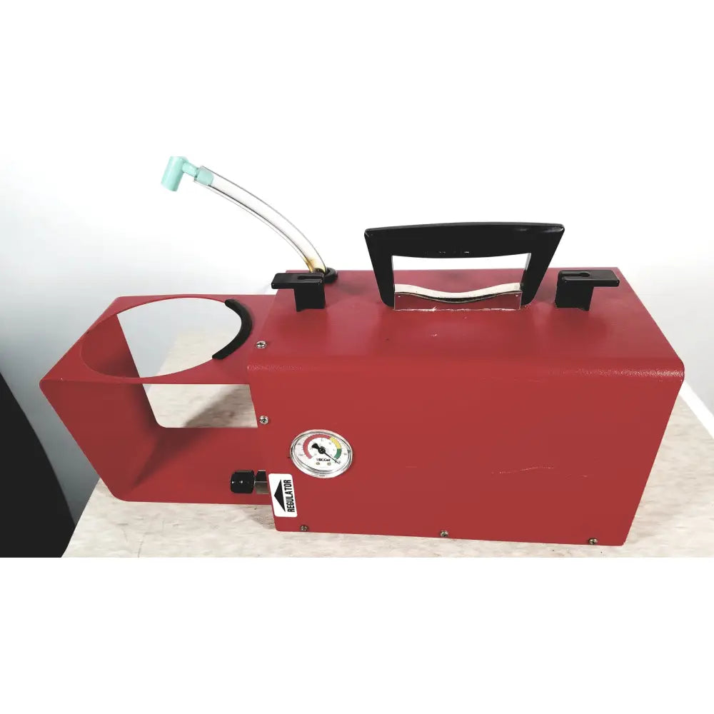 Red metal scort 40014b portable regulator suction unit with black handle and curved transparent hose attached on top
