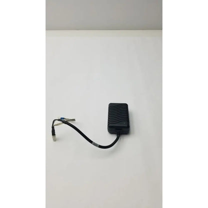 Black plastic safety mark 2403srm 30 charger with textured ribbed surface and coiled cable ending in connector