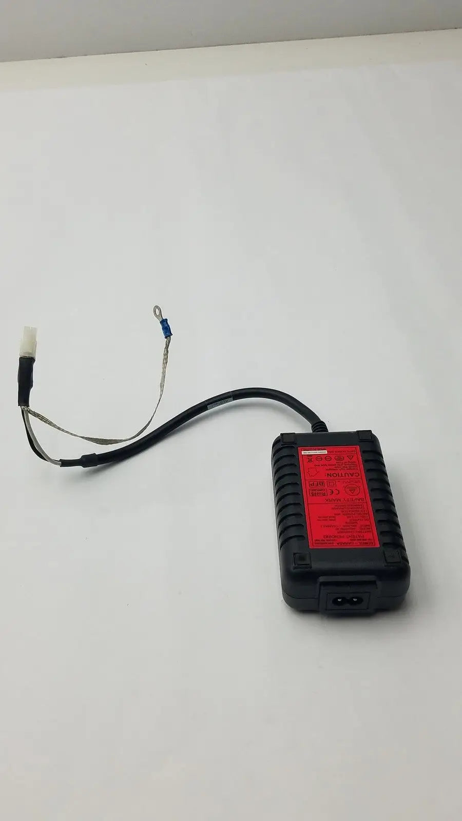 Black rectangular power adapter with red label and white connector for safety mark 2403srm 30 charger