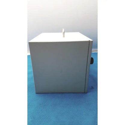 Gray metal safevac smoke evacuator with white top and black handle designed for reuse medical applications