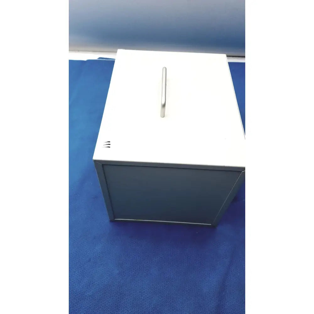 White metal filing cabinet with silver handle and ventilation slots side for safevac smoke evacuator ev 09ev063