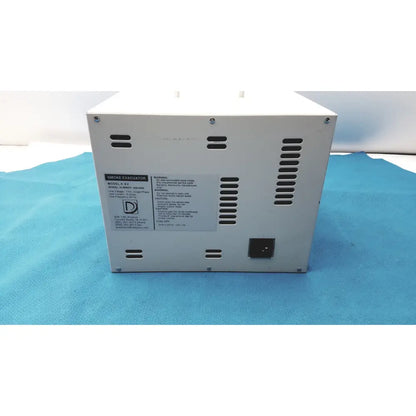 White rectangular safevac smoke evacuator ev 09ev063 back side with ventilation slots and power input port