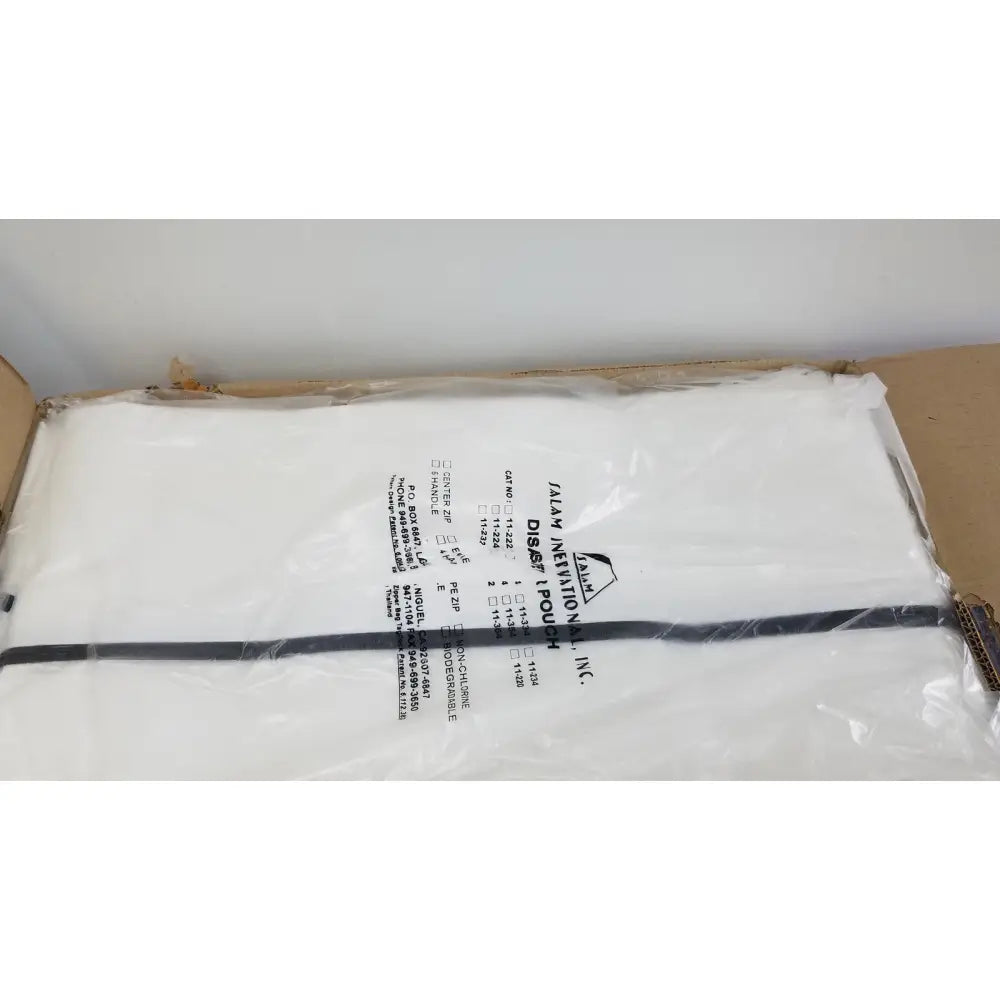 White plastic salam international disaster pouch body bag with black seal strip and jam inventions inc label center zip closure
