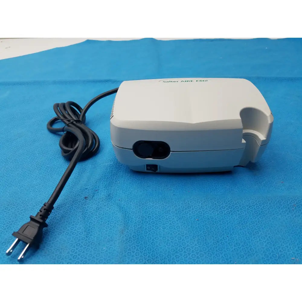 White salter labs aire elite compressor nebulizer with black power cord and plug for respiratory therapy use