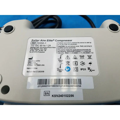White plastic salter labs aire elite compressor nebulizer with black ports and label showing specs and compliance markings