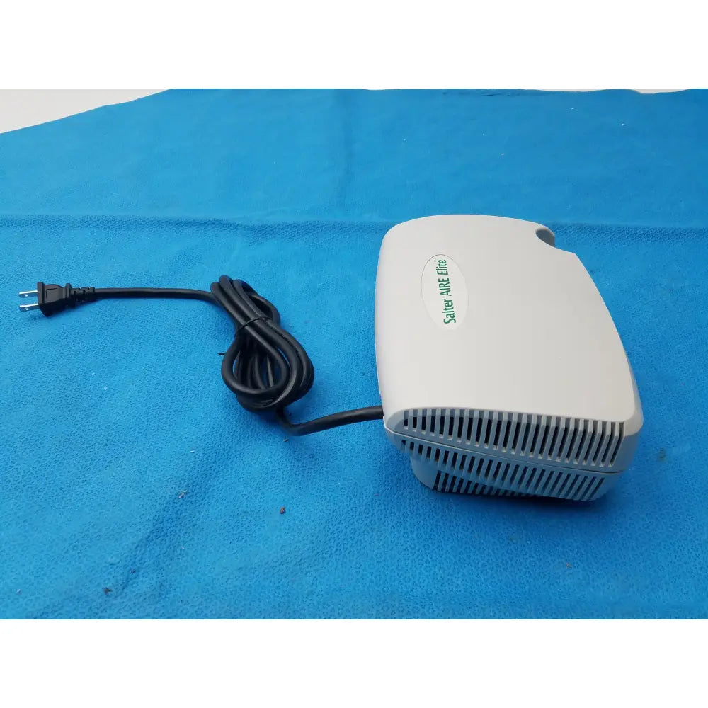White salter labs aire elite compressor nebulizer with black power cord and vented front panel for respiratory therapy