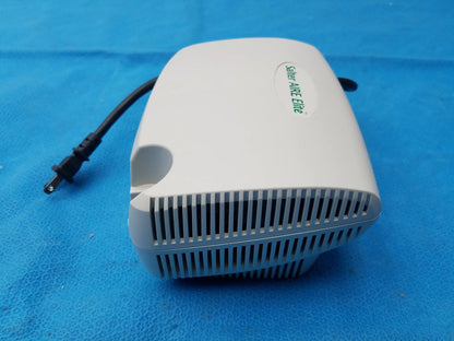 White plastic salter labs aire elite compressor nebulizer with green branding and a black power cord