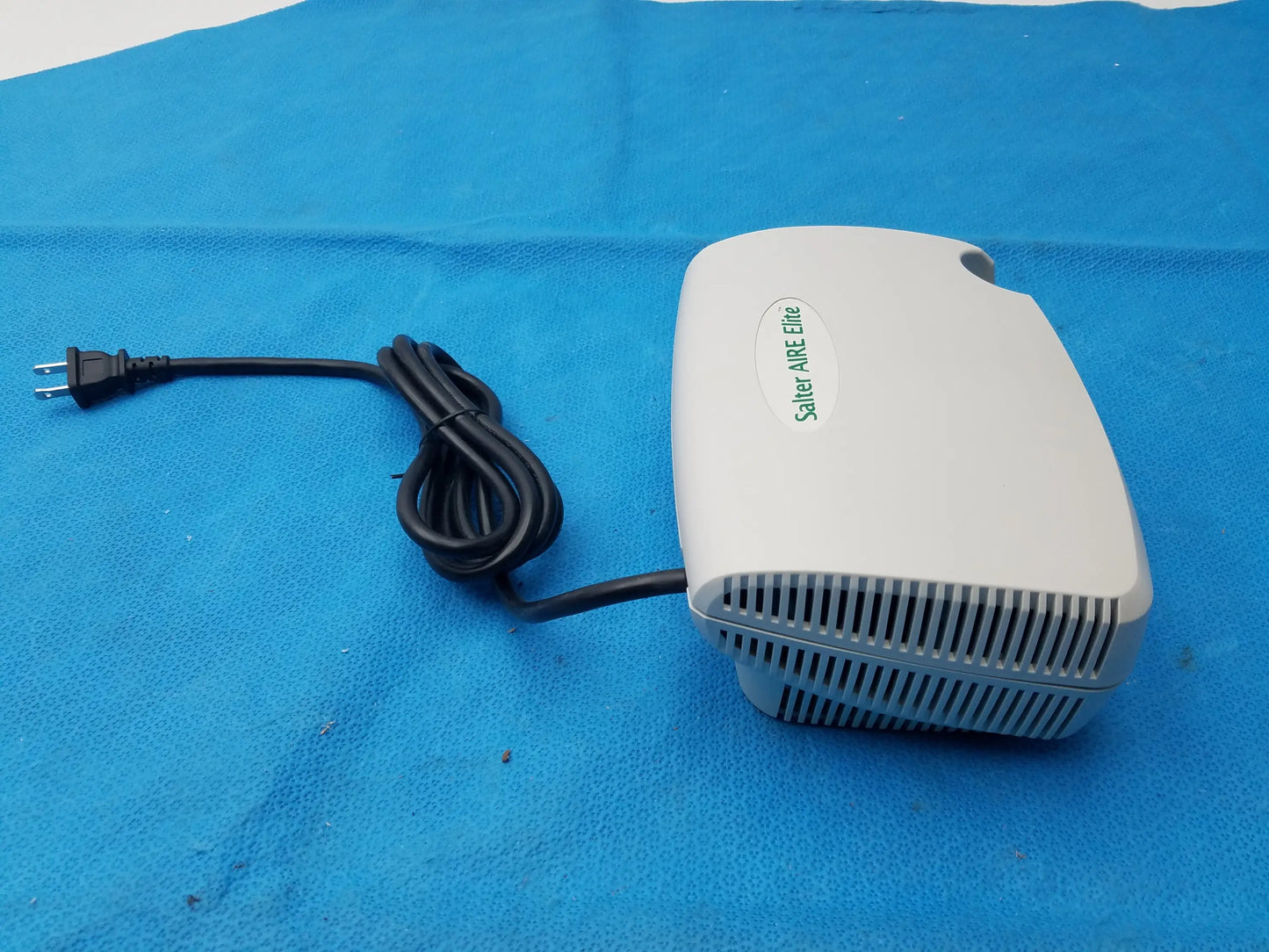 White salter labs aire elite compressor nebulizer with black power cord and vented front panel for respiratory therapy